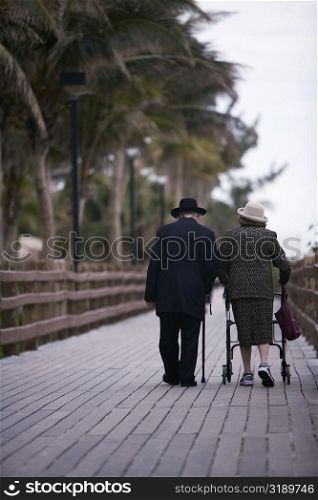 Senior couple walking on a walkway, Miami, Florida, USA