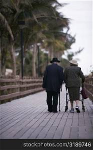 Senior couple walking on a walkway, Miami, Florida, USA