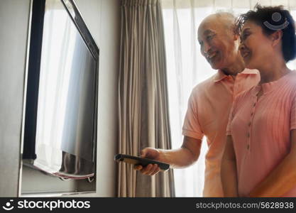 Senior couple watching TV