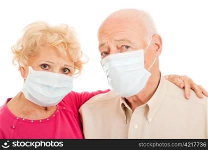 Senior couple wearing face masks to protect against swine flu epidemic.