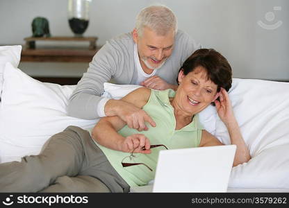 Senior couple with a laptop