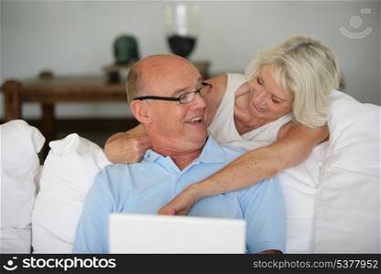 Senior couple with a laptop