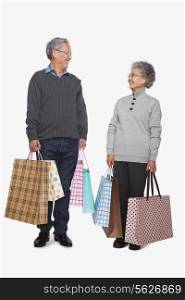 Senior couple with shopping bags