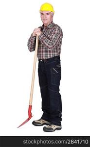 senior craftsman holding a shovel