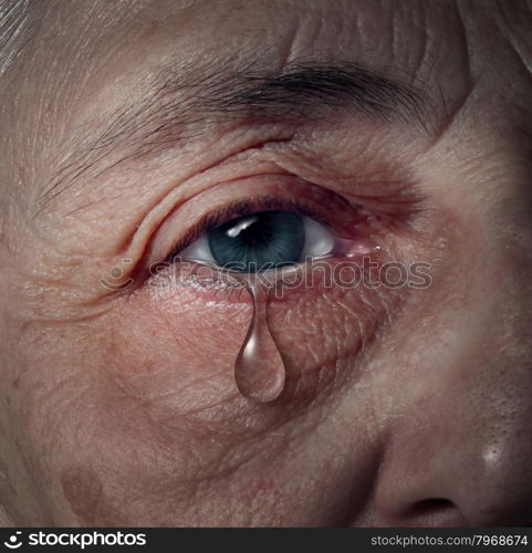 Senior depression and elderly mental health issues related to loneliness and emotional illness based on grief or chemical imbalance causing anxiety as a close up of an aging human eye crying a tear drop.