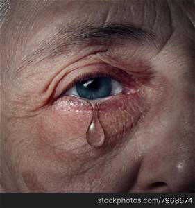 Senior depression and elderly mental health issues related to loneliness and emotional illness based on grief or chemical imbalance causing anxiety as a close up of an aging human eye crying a tear drop.