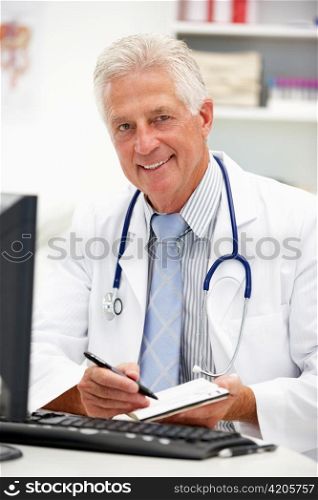 Senior doctor at desk