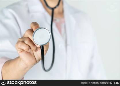 senior doctor or physician hold stethoscope in the hospital. Concept Of Medical Technology and Healthcare Business