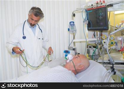 senior doctor with his sick patient