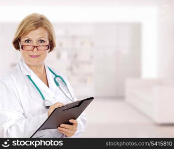 Senior doctor woman with a clipboard in the hospital