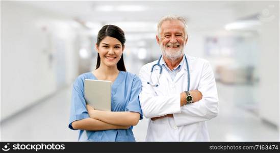 Senior doctor working with young doctor in the hospital. Medical healthcare staff and doctor service.