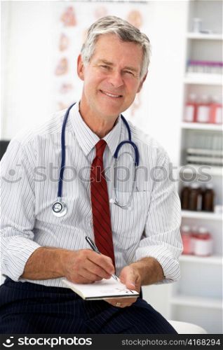 Senior doctor writing prescription