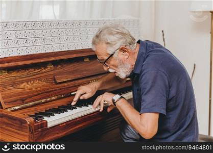 Senior Elderly musician enjoy happy playing music with Piano prevent Alzheimer disease.