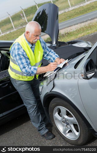 senior establishing friendly report after trafic accident