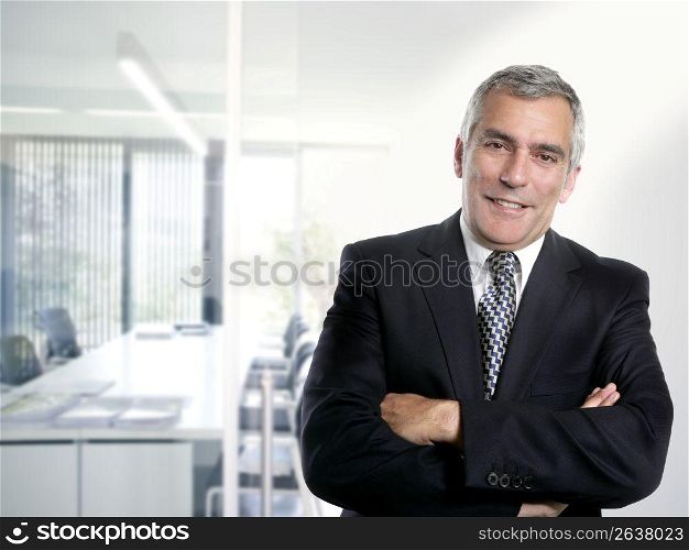 senior expertise gray hair businessman posing interior white modern office