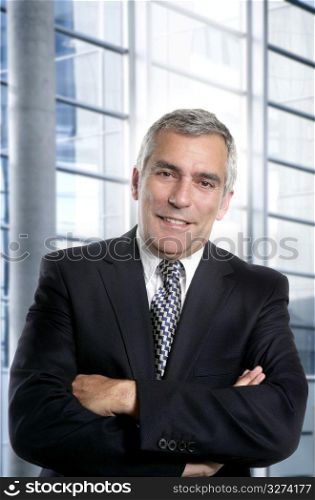senior expertise gray hair businessman posing interior white modern office