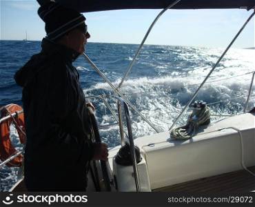 Senior fisherman sailing