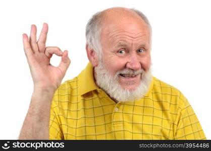 senior funny bald man in yellow t-shirt is shows gestures and grimaces