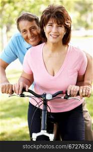 Senior Hispanic couple with bike