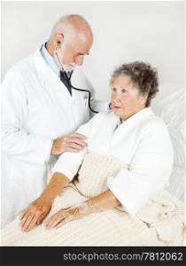 Senior hospital patient gets a thorough medical exam from her doctor.