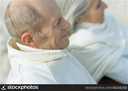 Senior in white couple looking away