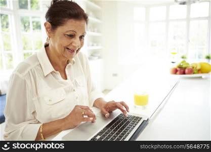 Senior Indian Woman Using Laptop At Home