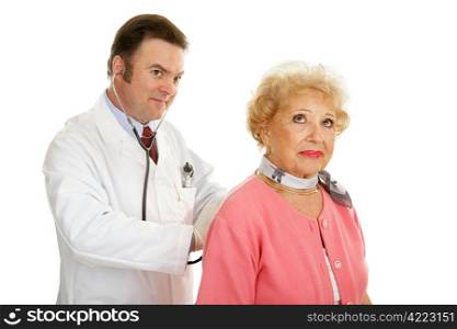 Senior lady getting a checkup from her doctor. Isolated on white.