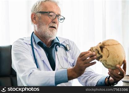 Senior male doctor working in hospital. Medical and healthcare concept.