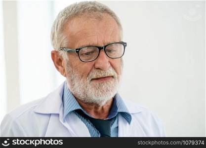 Senior male doctor working in hospital. Medical healthcare and doctor service.