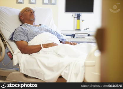 Senior Male Patient Resting In Hospital Bed