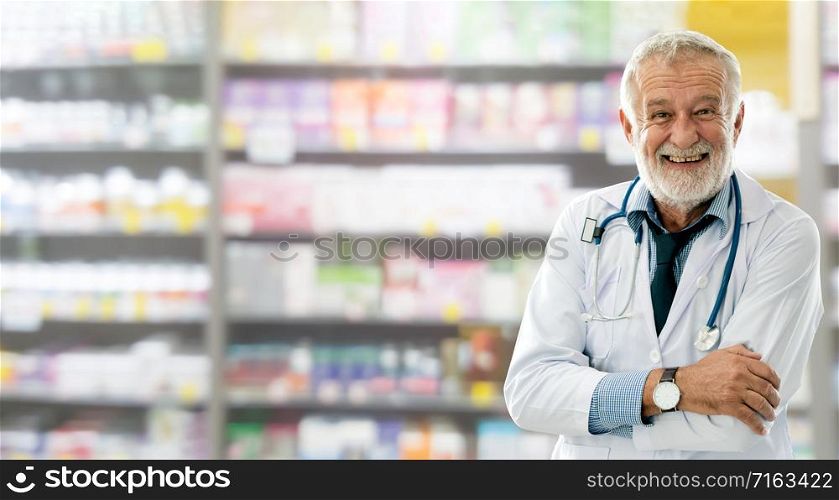 Senior male pharmacist working at the pharmacy. Medical healthcare and pharmaceutical service.