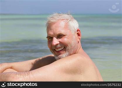 Senior man alone at the beach