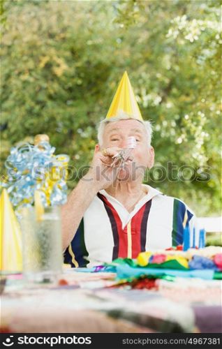 Senior man at a birthday party