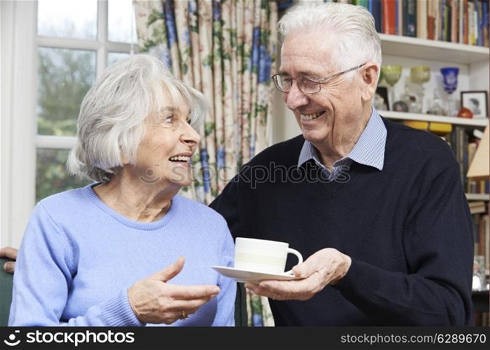 Senior Man Bringing Wife Cup Of Tea
