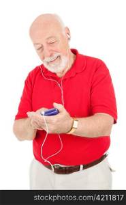 Senior man browsing his music collection on his mp3 player. Isolated on white.