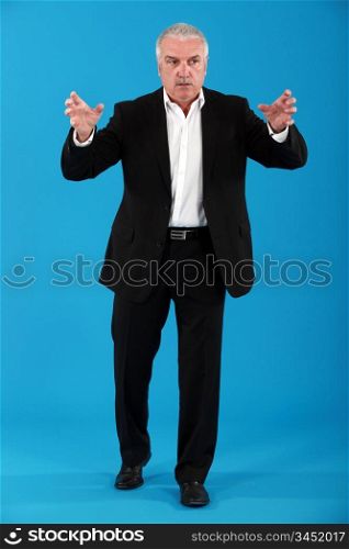 Senior man carrying object representing his hands