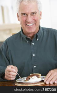 Senior Man Eating Chocolate Cake