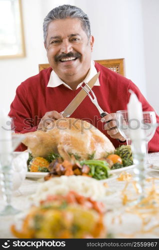 Senior Man Excitedly Getting Ready To Carve The Turkey