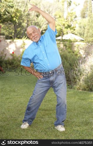Senior Man Exercising In Garden
