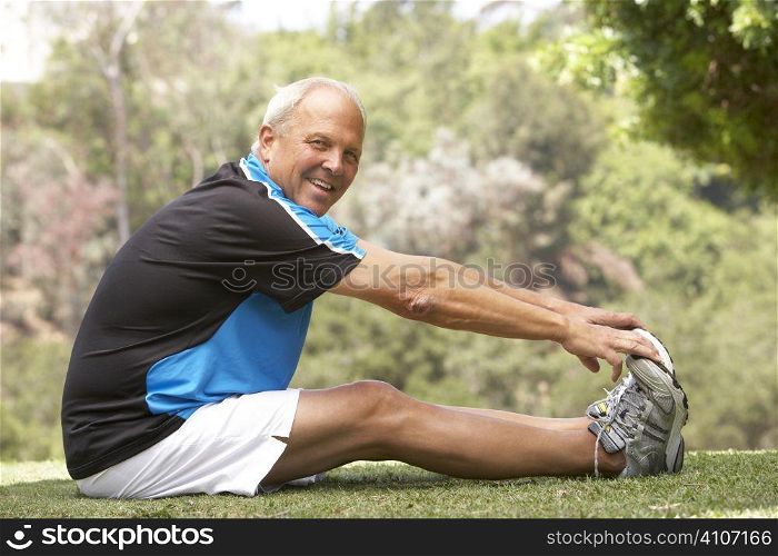 Senior Man Exercising In Park