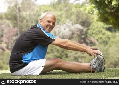 Senior Man Exercising In Park