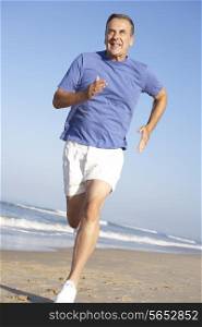 Senior Man Exercising On Beach