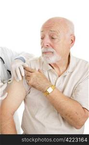Senior man getting a shot. Could be medicine or vaccine. White background.