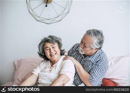 Senior man giving a massage to his wife