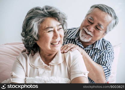 Senior man giving a massage to his wife