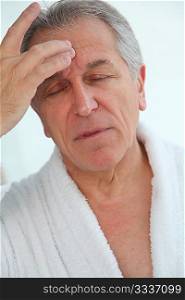 Senior man having a headache