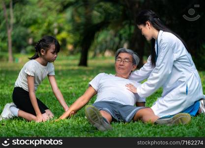 Senior man having chest pain or heart attack in the park. Old people elderly healthcare concept.