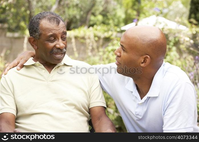 Senior Man Having Serious Conversation Adult Son