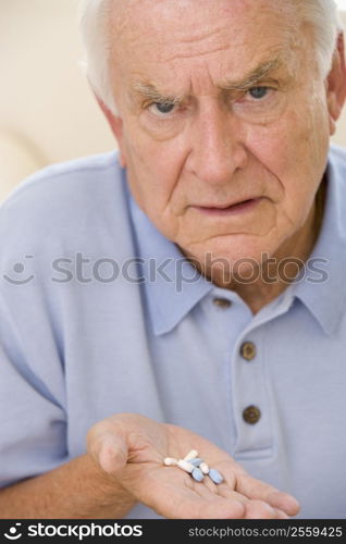 Senior Man Holding Prescription Drugs