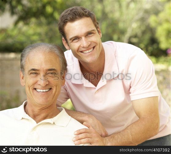 Senior Man Hugging Adult Son